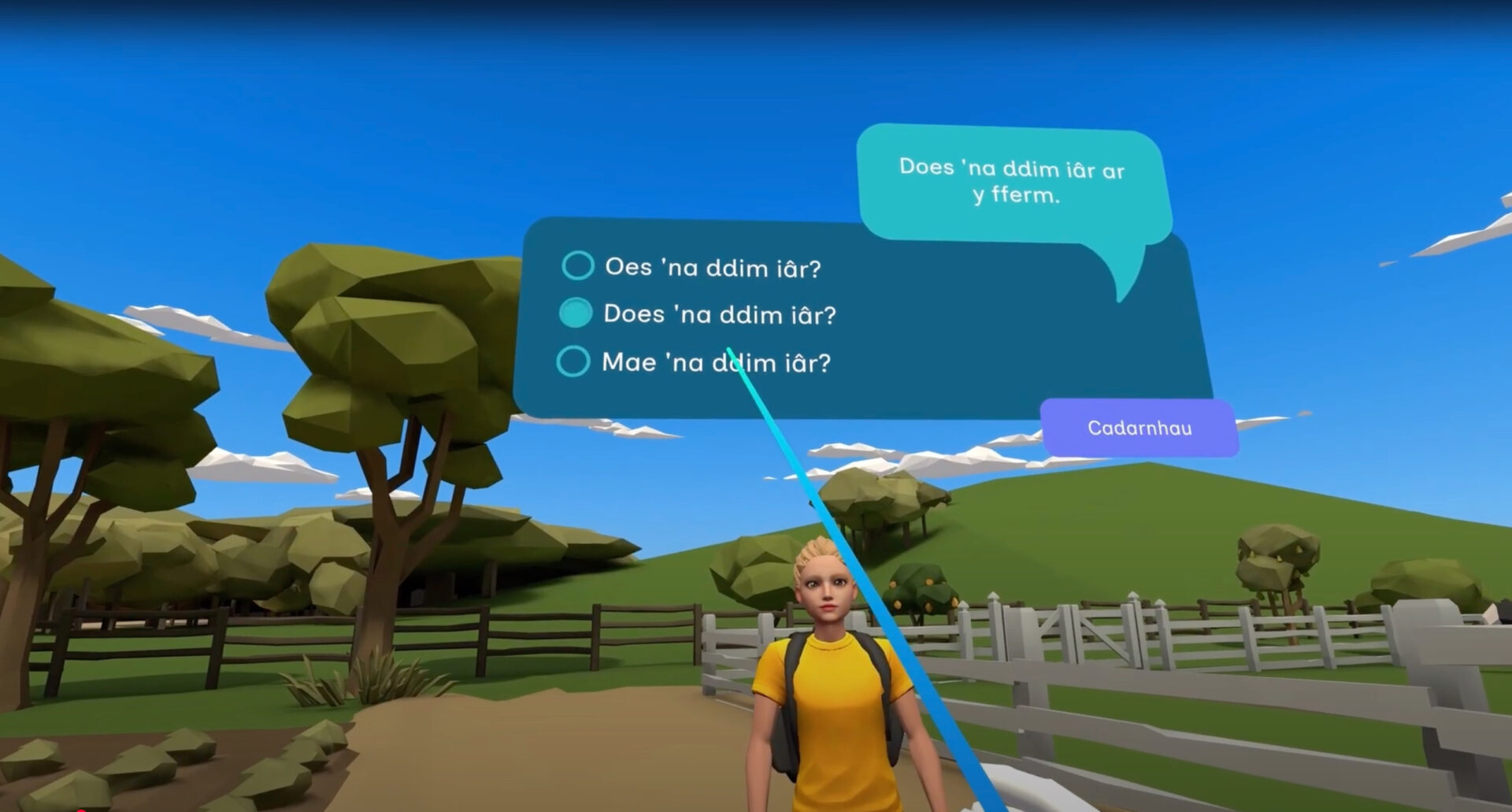 Screenshot of a virtual reality Welsh language learning environment. A character stands on a farm path with fields, trees, and fences in the background. On-screen text shows a Welsh sentence and multiple-choice options for translation or grammar practice. A blue pointer highlights the sentence “Does 'na ddim iâr?” and a purple button labelled “Cadarnhau” (Confirm) is below. Sgrinlun o amgylchedd rhithwir ar gyfer dysgu’r Gymraeg. Mae cymeriad yn sefyll ar lwybr fferm gyda chaeau, coed a ffensys yn y cefndir. Mae testun ar y sgrin yn dangos brawddeg Gymraeg a dewisiadau lluosog ar gyfer ymarfer cyfieithu neu ramadeg. Mae pwyntydd glas yn amlygu’r frawddeg “Does 'na ddim iâr?” ac mae botwm porffor o dan y testun gyda’r gair “Cadarnhau”.